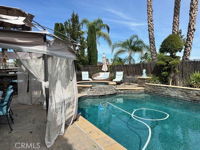 23422 Camino Terraza Road Corona, CA 92883 - Photo 44 of 47 a view of a house with swimming pool and sitting area