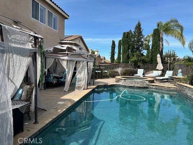 23422 Camino Terraza Road Corona, CA 92883 - Photo 45 of 47 a view of a house with pool and sitting area