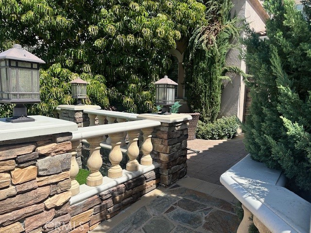 23422 Camino Terraza Road Corona, CA 92883 - Photo 5 of 47 a view of an outdoor sitting area with brick walls