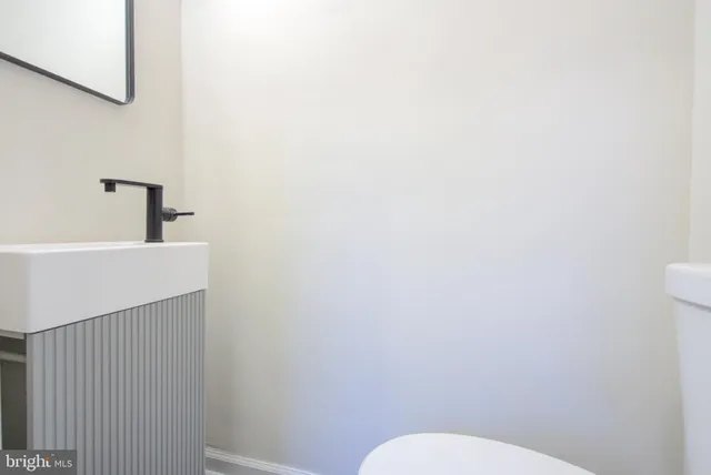 a bathroom with a sink a toilet