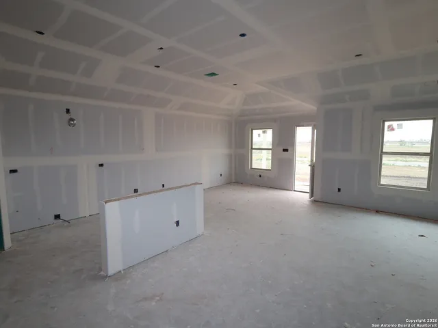 an empty room with windows