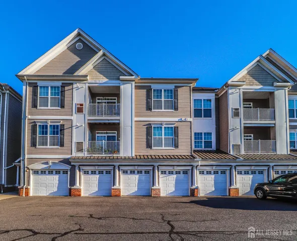 a front view of residential houses with street