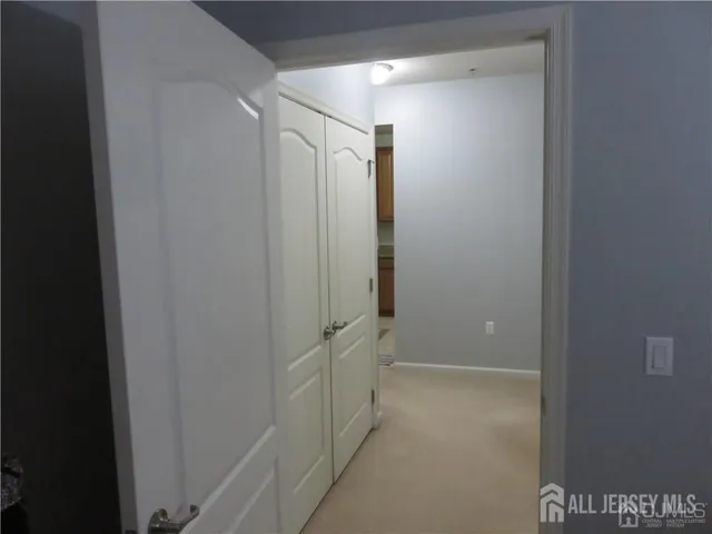 a kitchen with a refrigerator and a sink
