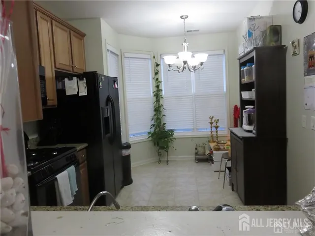 a view of a livingroom with furniture and hallway