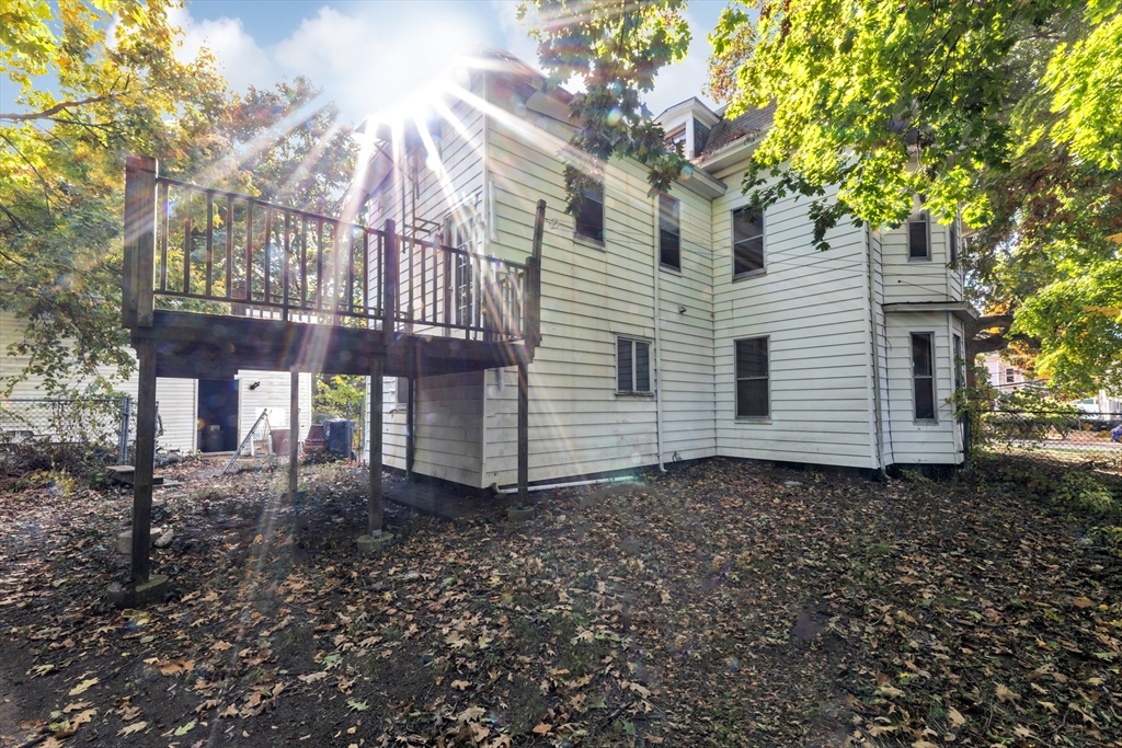 54 Oak Street Boston, MA 02136 - Photo 12 of 13 a view of a house with a yard