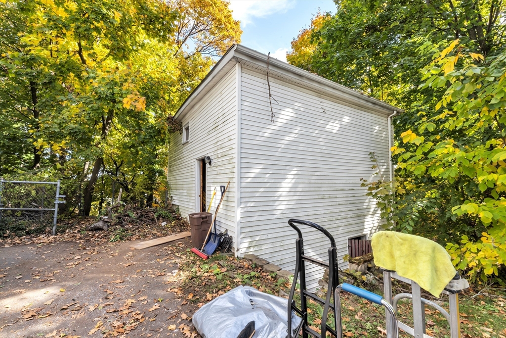 54 Oak Street Boston, MA 02136 - Photo 13 of 13 a backyard of a house with table and chairs
