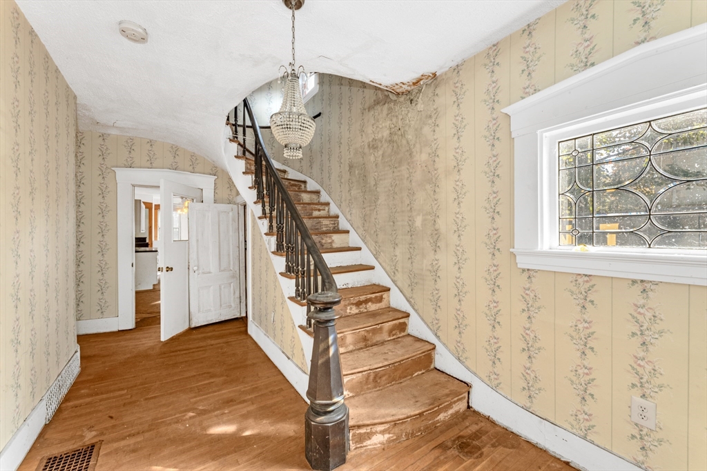 54 Oak Street Boston, MA 02136 - Photo 2 of 13 a view of a hallway with wooden floor and entryway