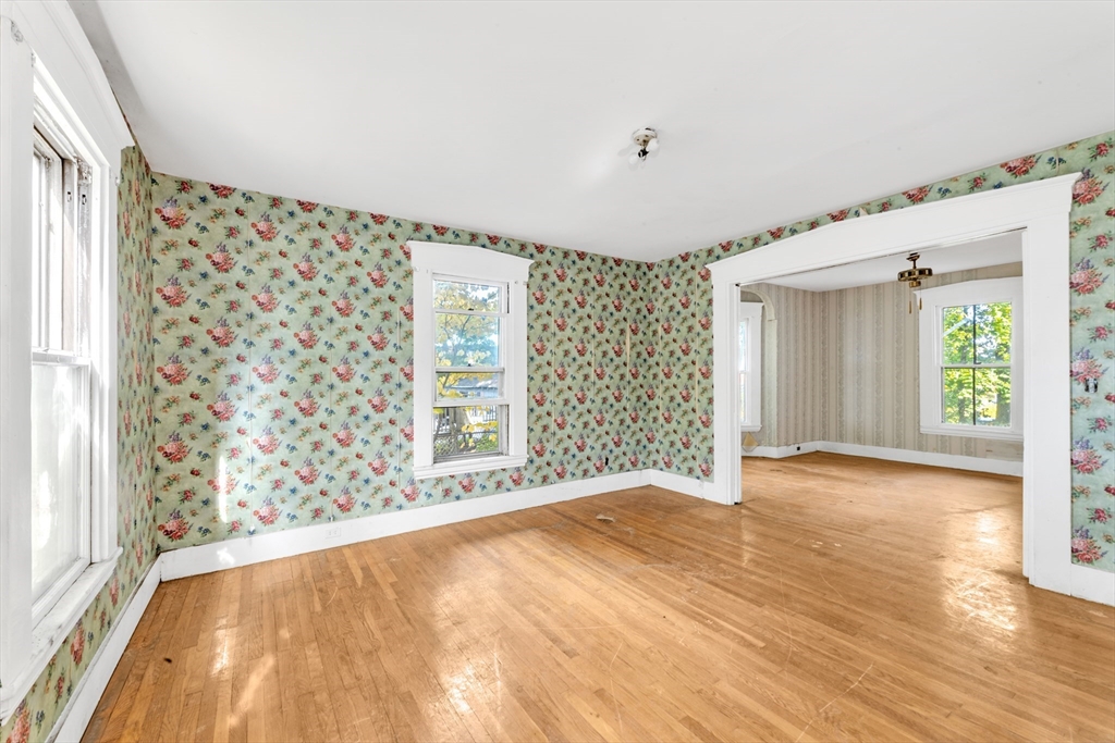 54 Oak Street Boston, MA 02136 - Photo 3 of 13 a view of an empty room with a window and wooden floor