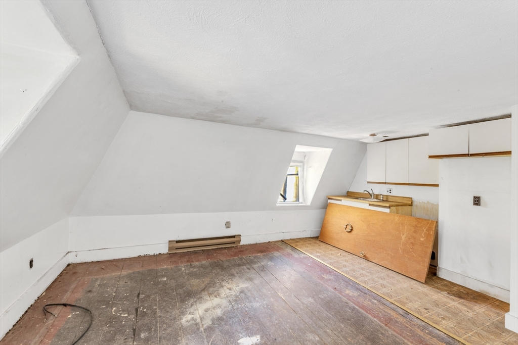 54 Oak Street Boston, MA 02136 - Photo 10 of 13 a view of a storage & utility room with a window