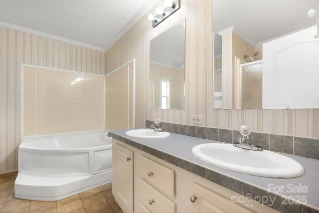 a bathroom with a double vanity sink and a mirror