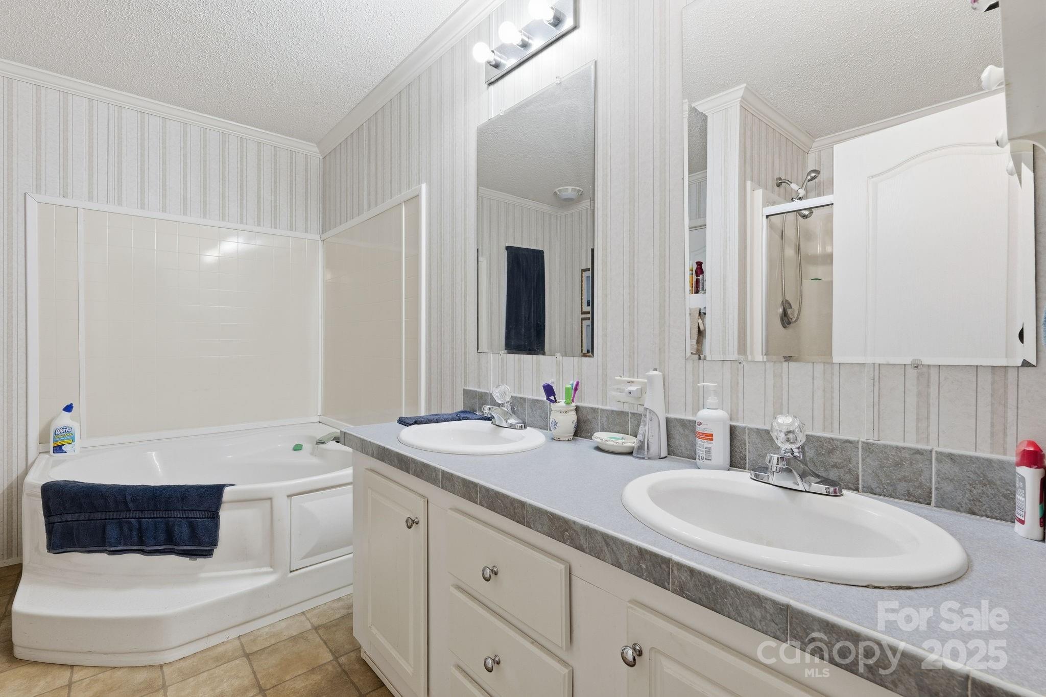 6351 Pleasant Grove Church Road Kannapolis, NC 28081 - Photo 14 of 24 a bathroom with a double vanity sink and mirror
