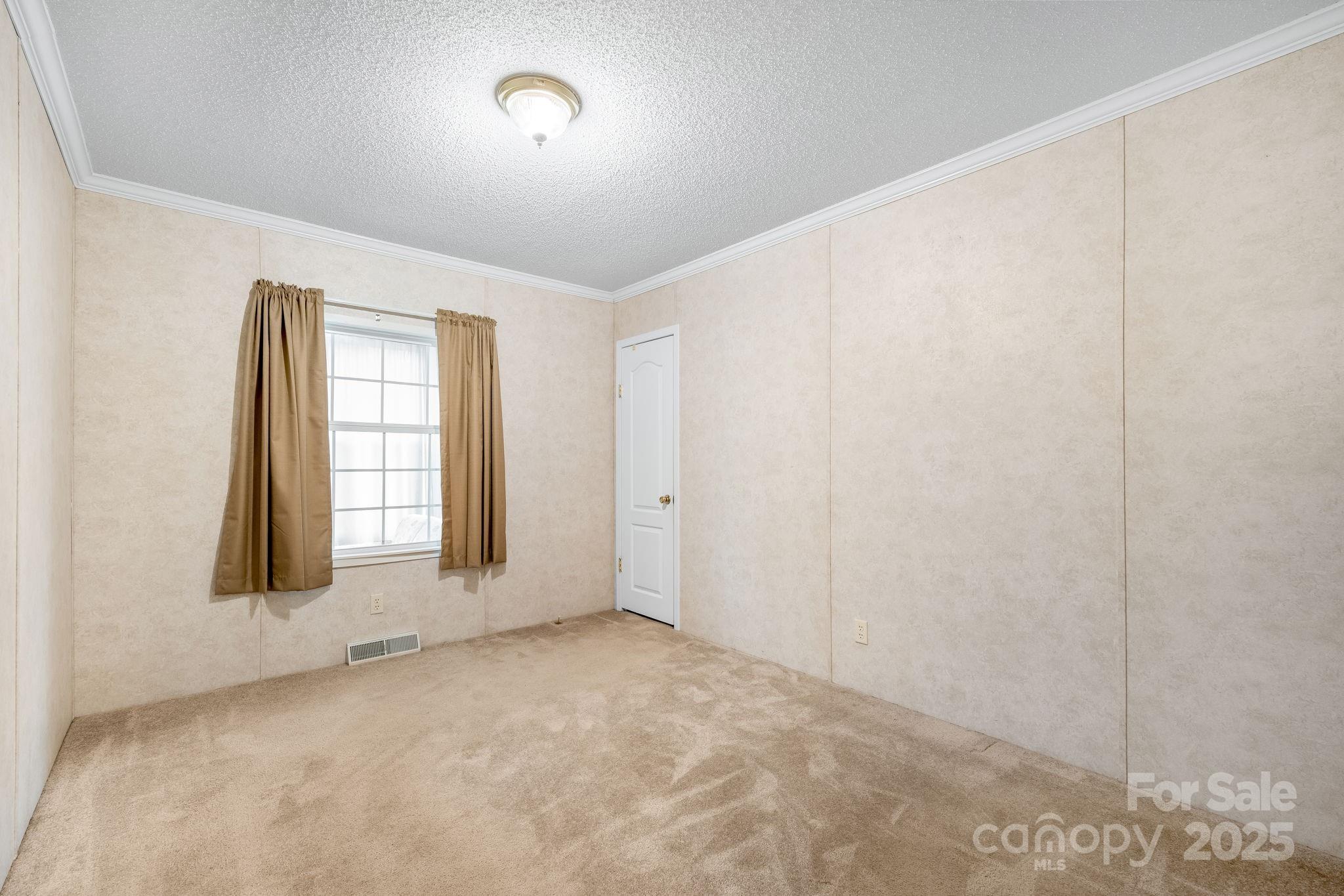 6351 Pleasant Grove Church Road Kannapolis, NC 28081 - Photo 14 of 21 an empty room with windows