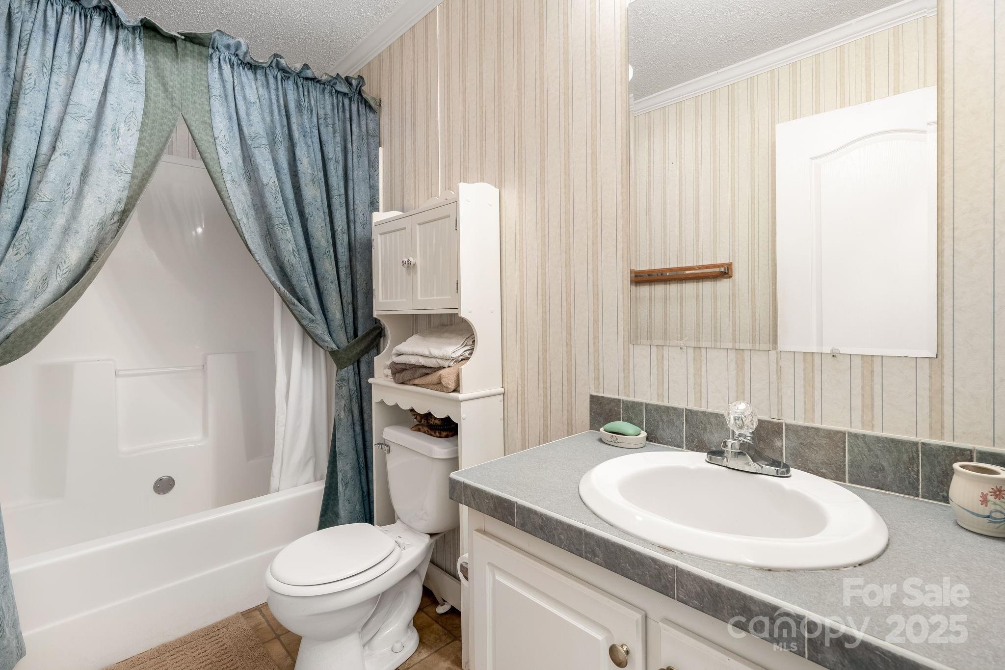 6351 Pleasant Grove Church Road Kannapolis, NC 28081 - Photo 16 of 21 a bathroom with a sink a toilet and a tub