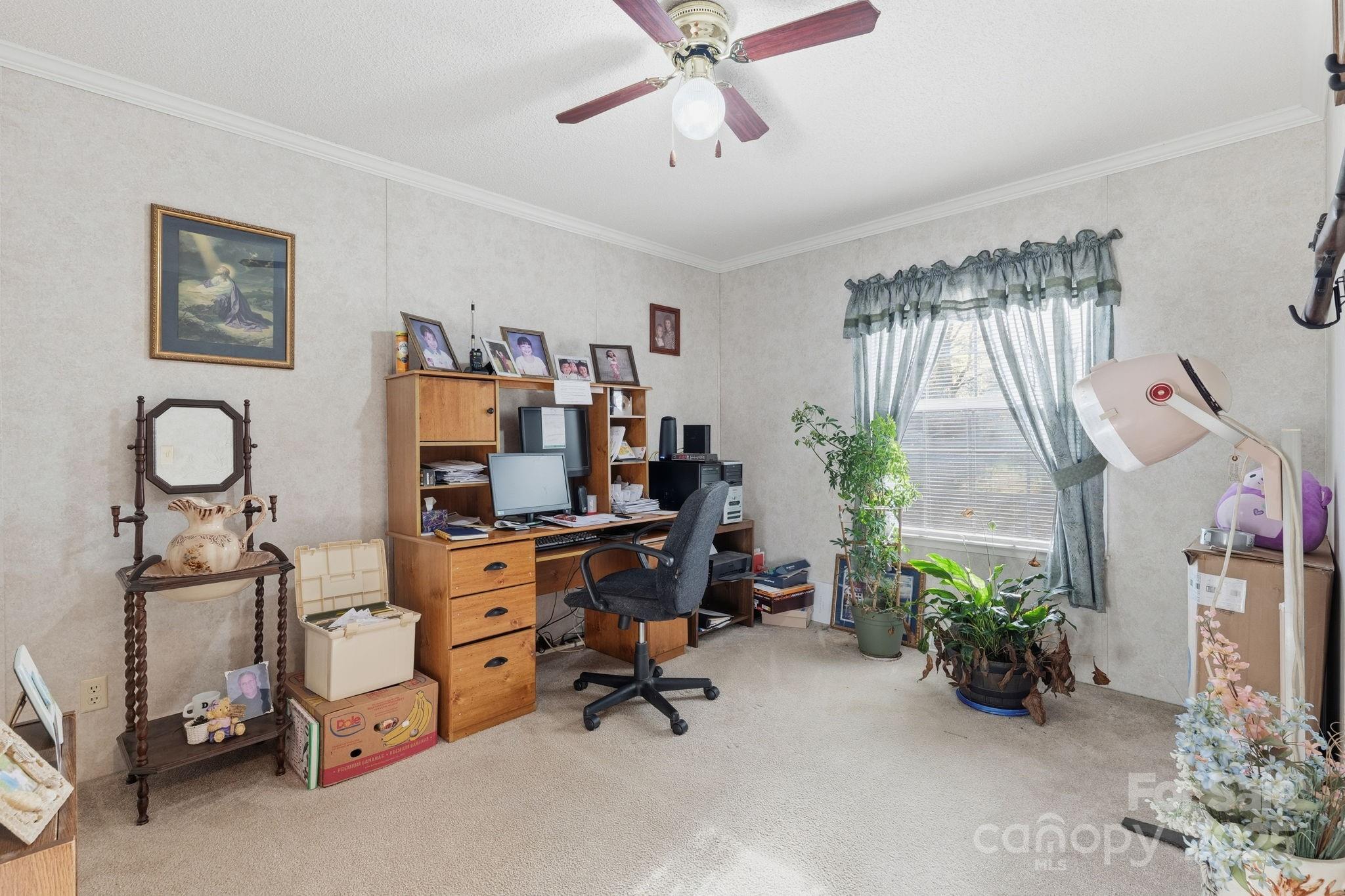 6351 Pleasant Grove Church Road Kannapolis, NC 28081 - Photo 17 of 24 a view of a workspace with furniture and a window