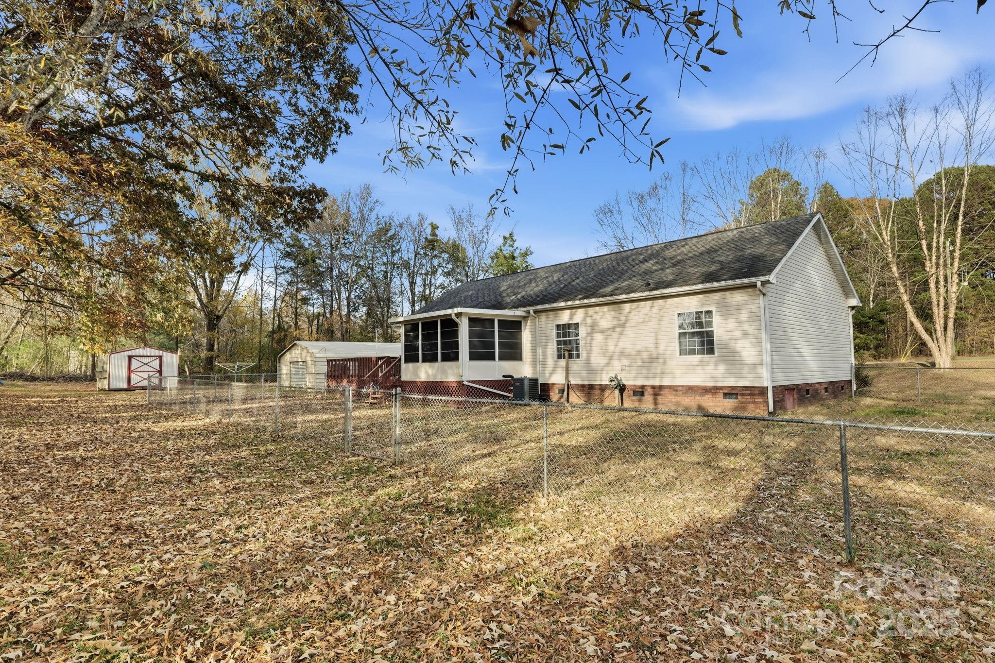 6351 Pleasant Grove Church Road Kannapolis, NC 28081 - Photo 19 of 21 a view of a house with a yard