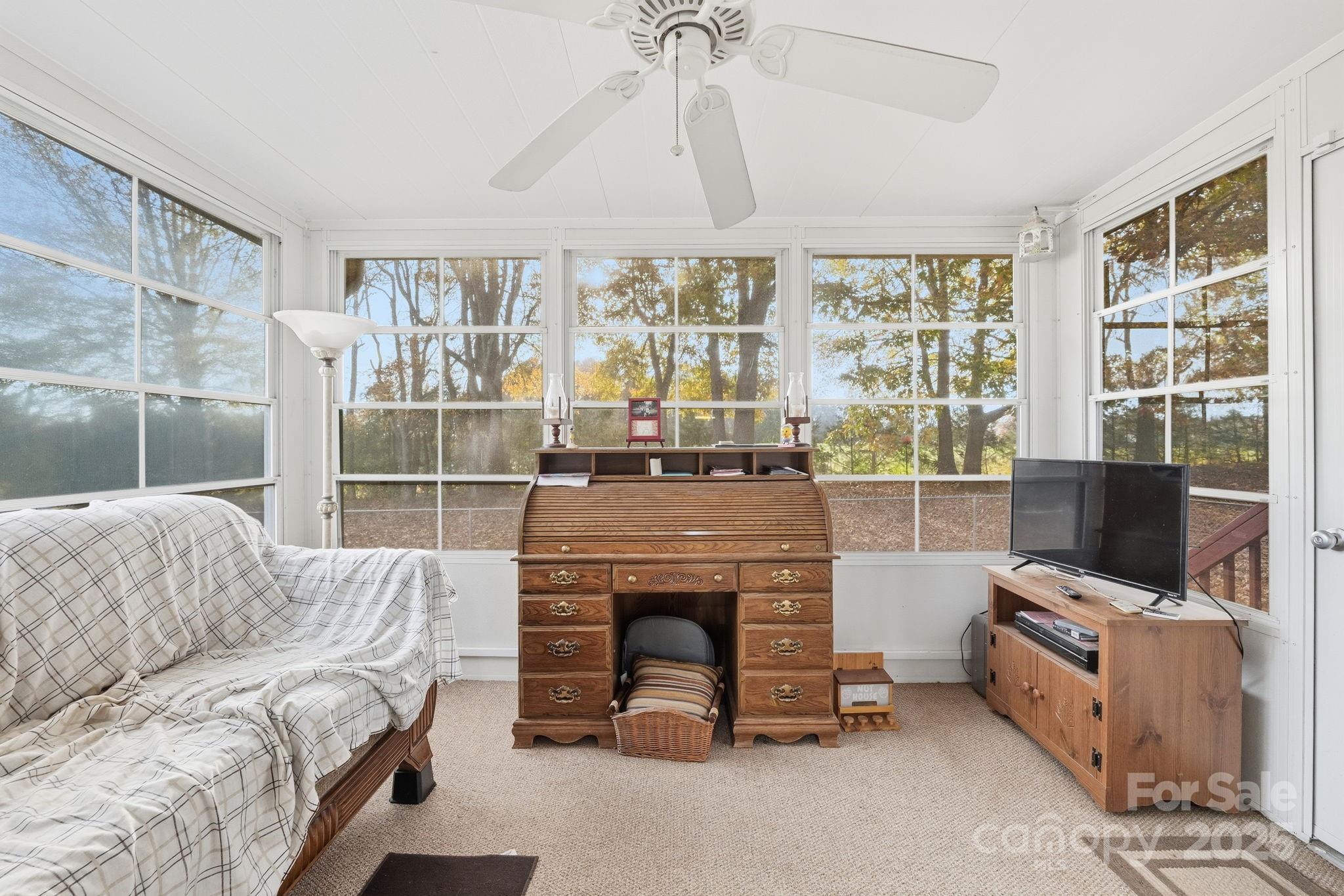 6351 Pleasant Grove Church Road Kannapolis, NC 28081 - Photo 21 of 24 a living room with furniture a fireplace and a flat screen tv