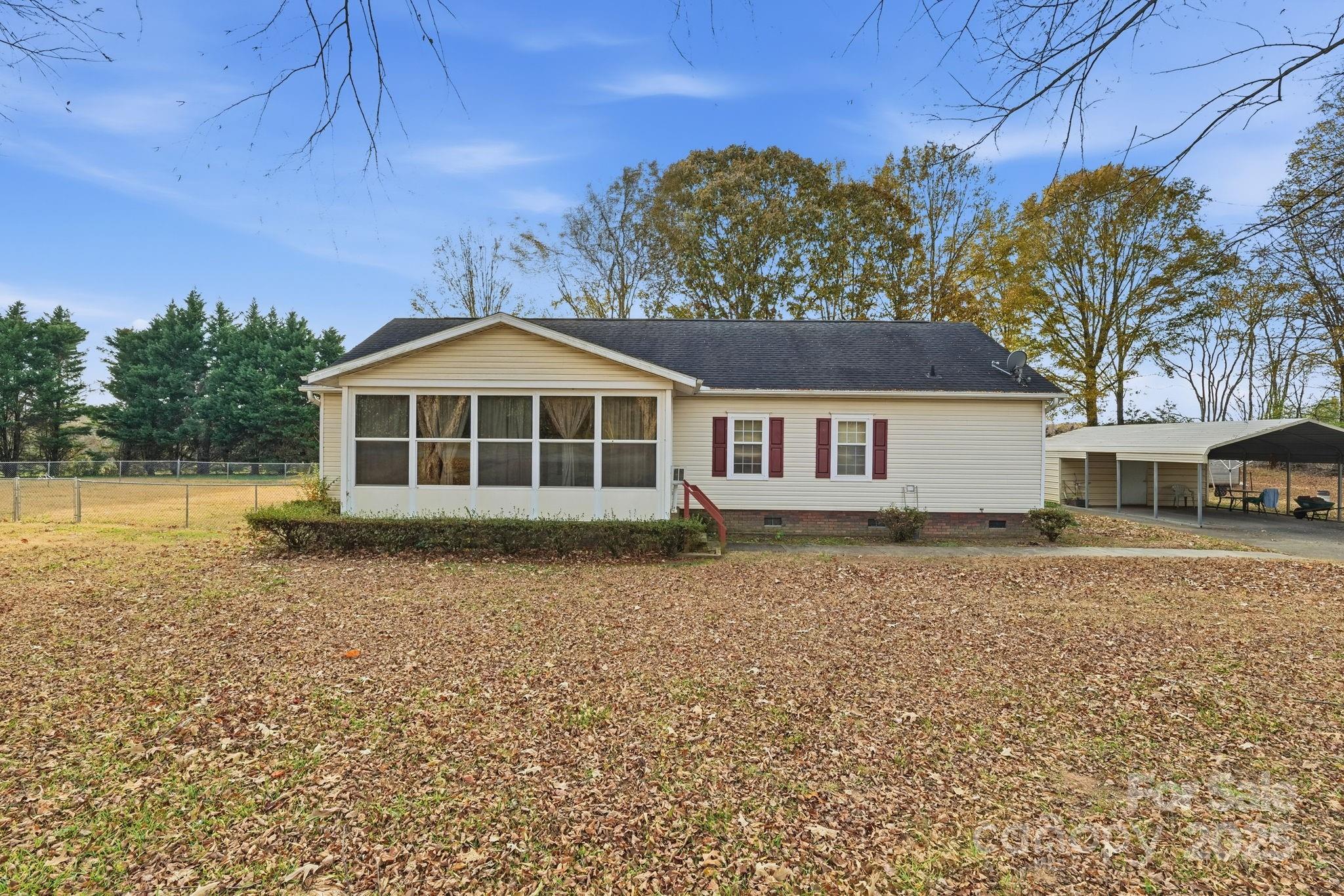 6351 Pleasant Grove Church Road Kannapolis, NC 28081 - Photo 3 of 21 a front view of a house with a garden