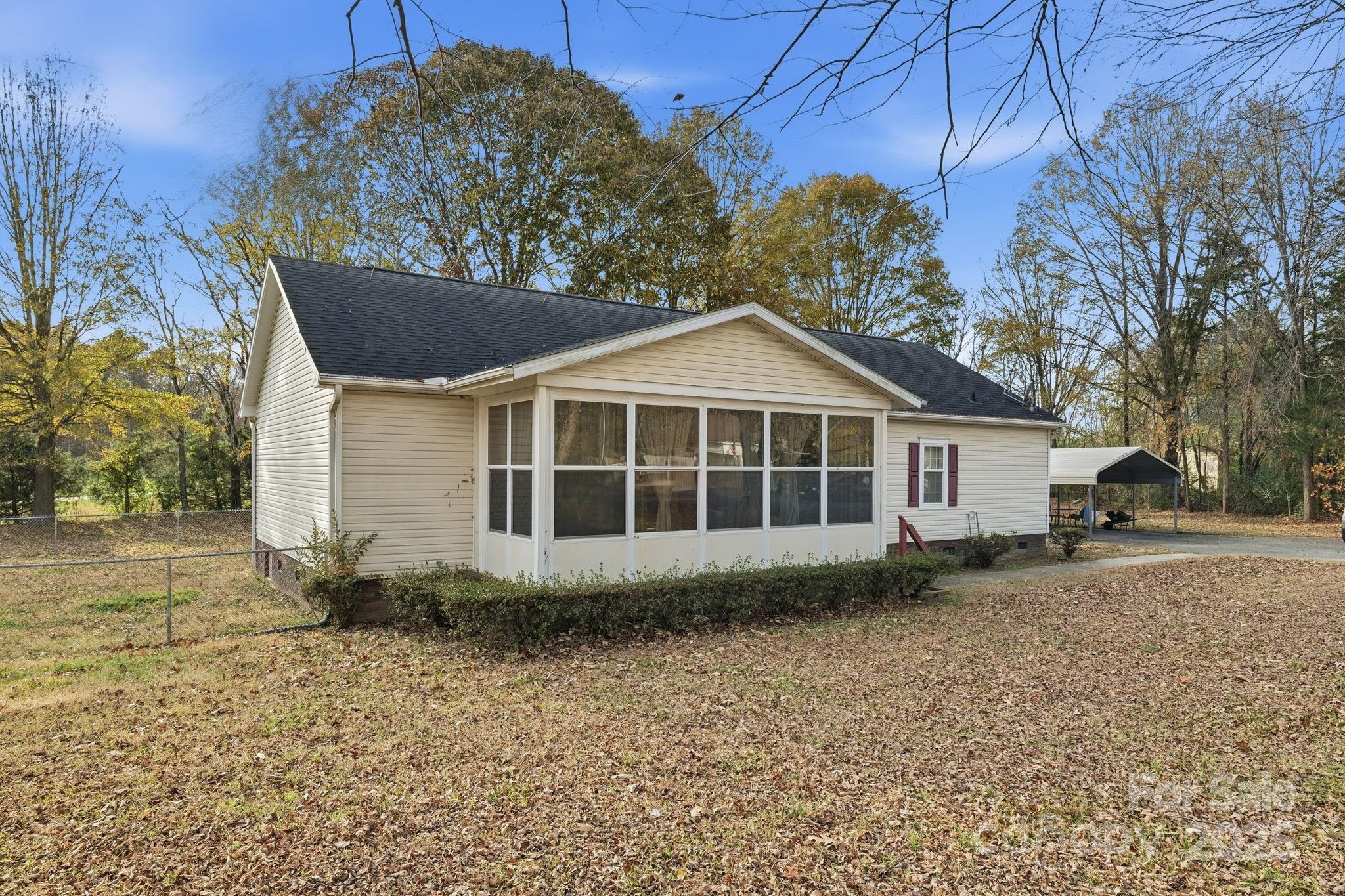 6351 Pleasant Grove Church Road Kannapolis, NC 28081 - Photo 4 of 21 a front view of a house with a yard