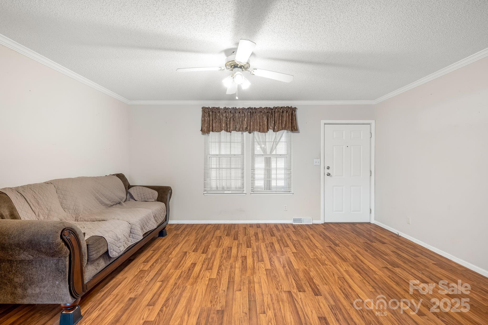 6351 Pleasant Grove Church Road Kannapolis, NC 28081 - Photo 5 of 21 a living room with a bed furniture and a window
