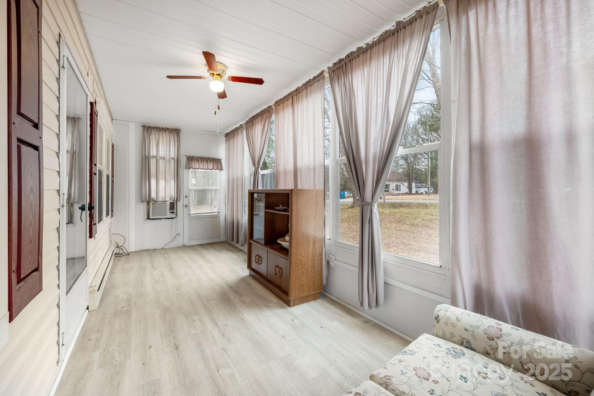 6351 Pleasant Grove Church Road Kannapolis, NC 28081 - Photo 7 of 21 a hallway with a large window and refrigerator