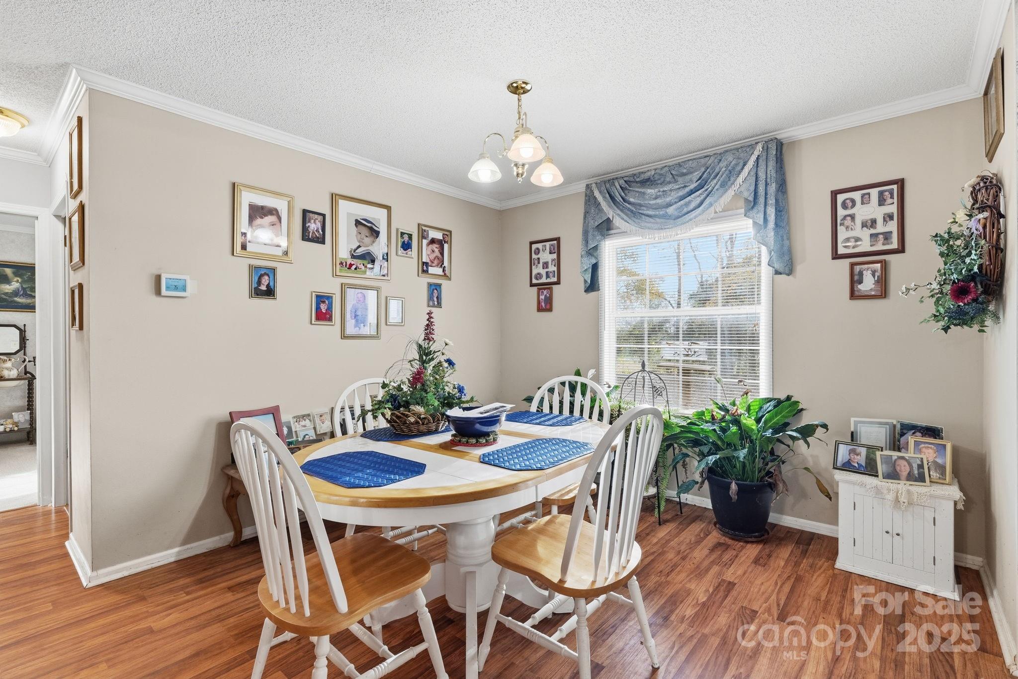 6351 Pleasant Grove Church Road Kannapolis, NC 28081 - Photo 8 of 24 a view of a dining room with furniture window and wooden floor