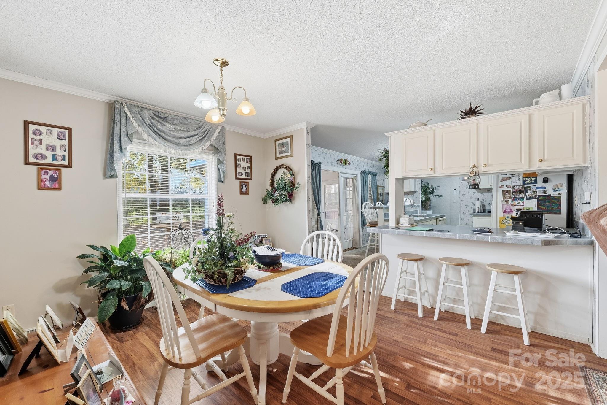 6351 Pleasant Grove Church Road Kannapolis, NC 28081 - Photo 9 of 24 a view of a dining room with furniture window and wooden floor
