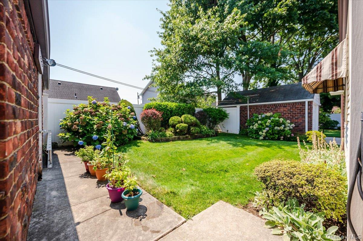 715 Iris Street Franklin Square, NY 11010 - Photo 18 of 20 a view of a garden with plants