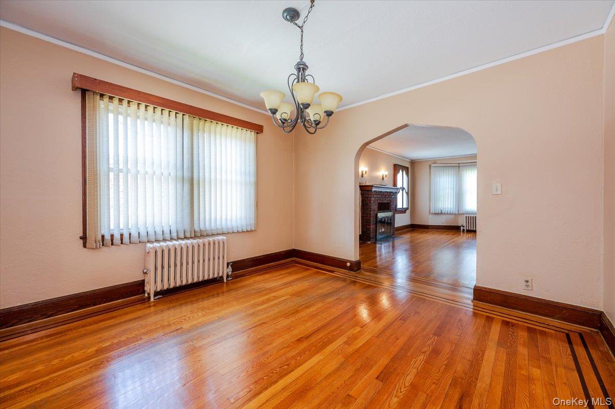 715 Iris Street Franklin Square, NY 11010 - Photo 5 of 20 a view of a livingroom with wooden floor and a window