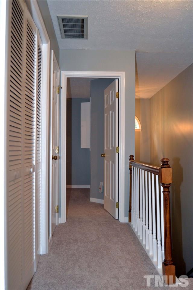 403 Broad Leaf Circle, Unit 403 Raleigh, NC 27613 - Photo 12 of 25 a view of a hallway with entryway door door