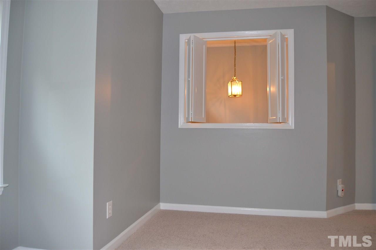 403 Broad Leaf Circle, Unit 403 Raleigh, NC 27613 - Photo 15 of 25 a view of a small space with wooden floor and a window
