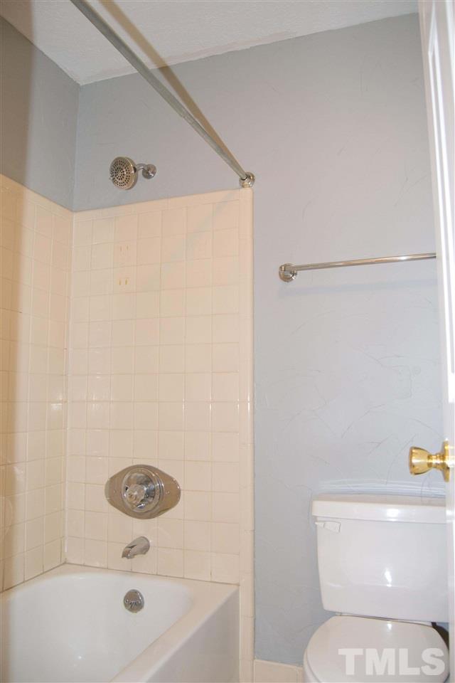 403 Broad Leaf Circle, Unit 403 Raleigh, NC 27613 - Photo 16 of 25 a bathroom with a sink and a toilet