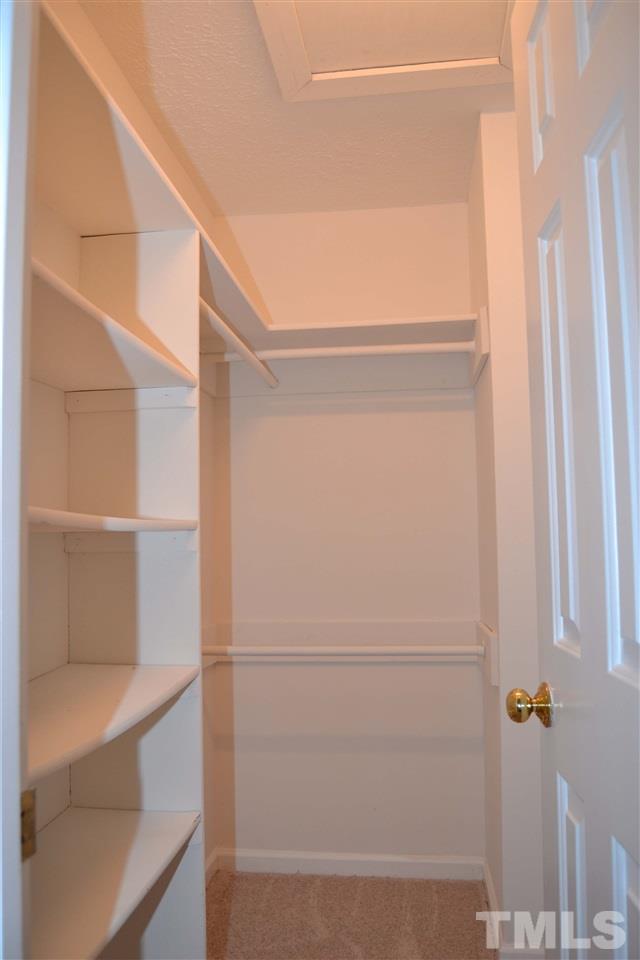 403 Broad Leaf Circle, Unit 403 Raleigh, NC 27613 - Photo 17 of 25 a view of walk in closet with empty racks