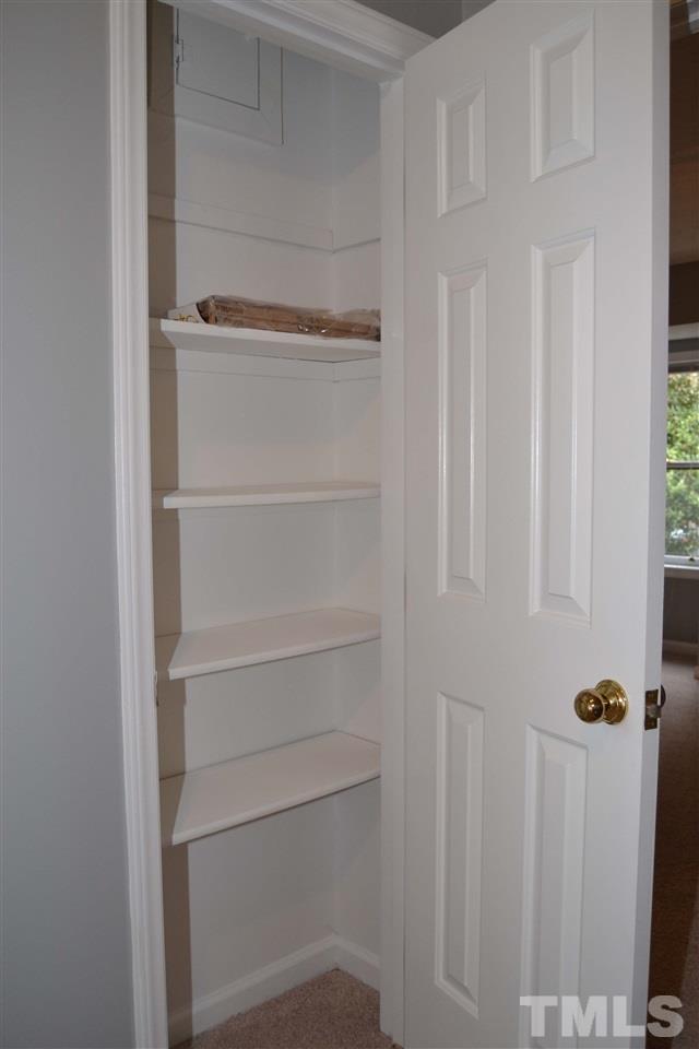403 Broad Leaf Circle, Unit 403 Raleigh, NC 27613 - Photo 19 of 25 a view of walk in closet with empty racks