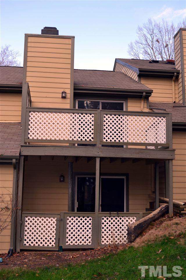 403 Broad Leaf Circle, Unit 403 Raleigh, NC 27613 - Photo 24 of 25 a view of a wooden house with a door