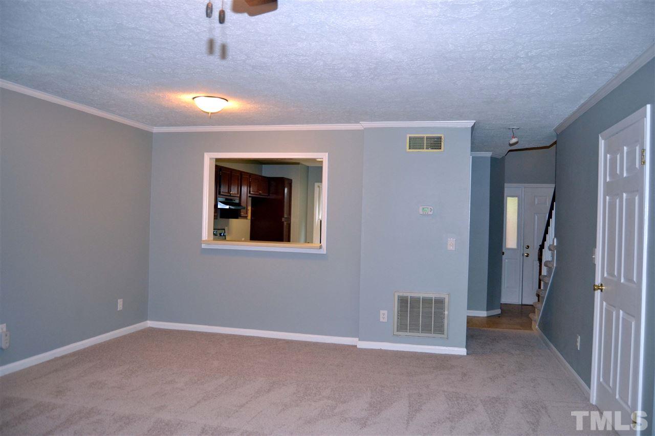 403 Broad Leaf Circle, Unit 403 Raleigh, NC 27613 - Photo 4 of 25 a view of an empty room with a window
