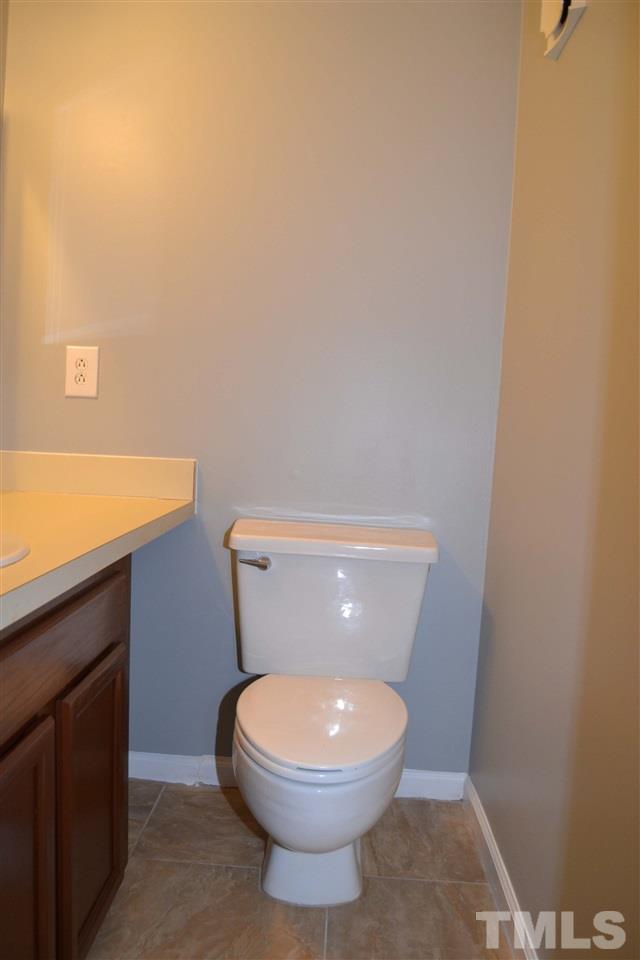 403 Broad Leaf Circle, Unit 403 Raleigh, NC 27613 - Photo 10 of 25 a bathroom with a toilet