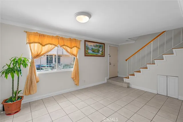 a view of entryway with window and wooden floor