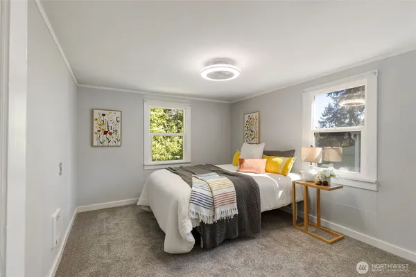 a bed room with a bed and a window