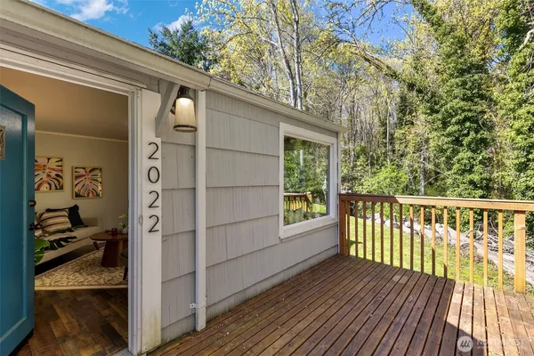 a view of a balcony with wooden floor