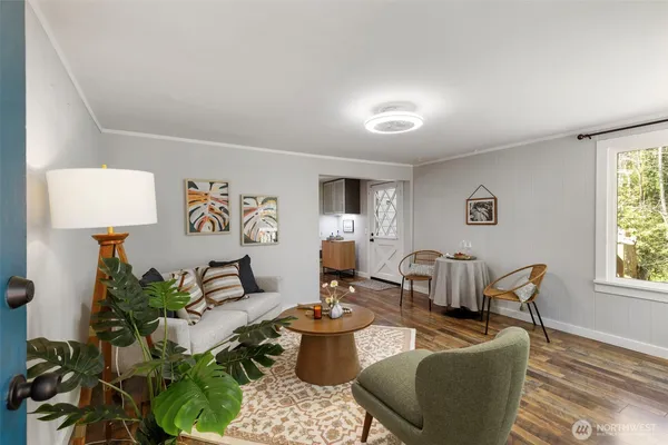 a living room with furniture and a window
