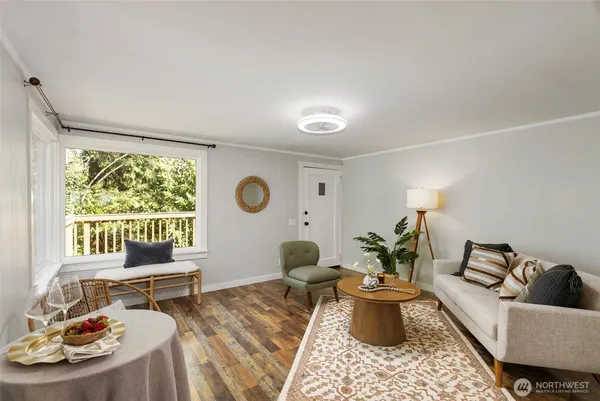 a living room with furniture and a window