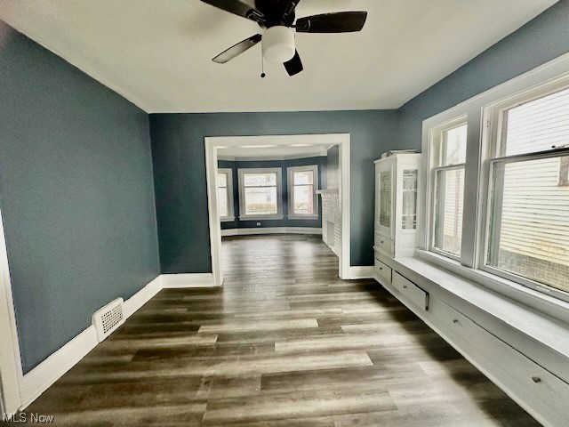 972 Paxton Road Cleveland, OH 44108 - Photo 8 of 22 Hallway with dark hardwood / wood-style flooring and plenty of natural light