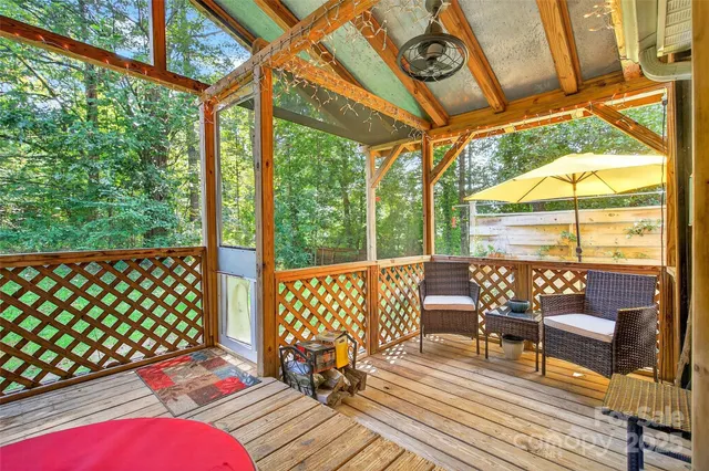 a view of a chairs on wooden deck