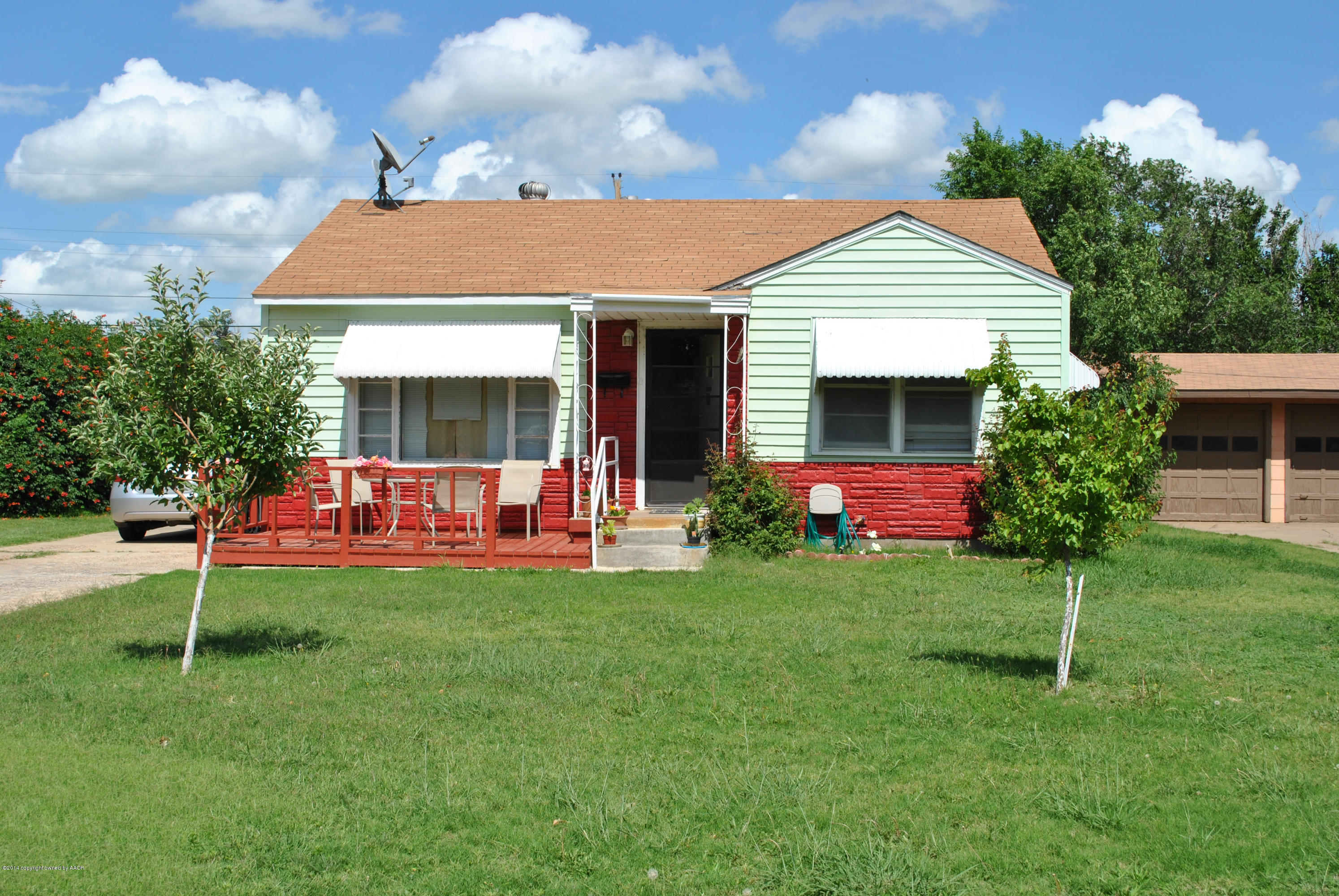 4625 Cline Road Amarillo, TX 79110 - Photo 2 of 16 a front view of house with yard and outdoor seating