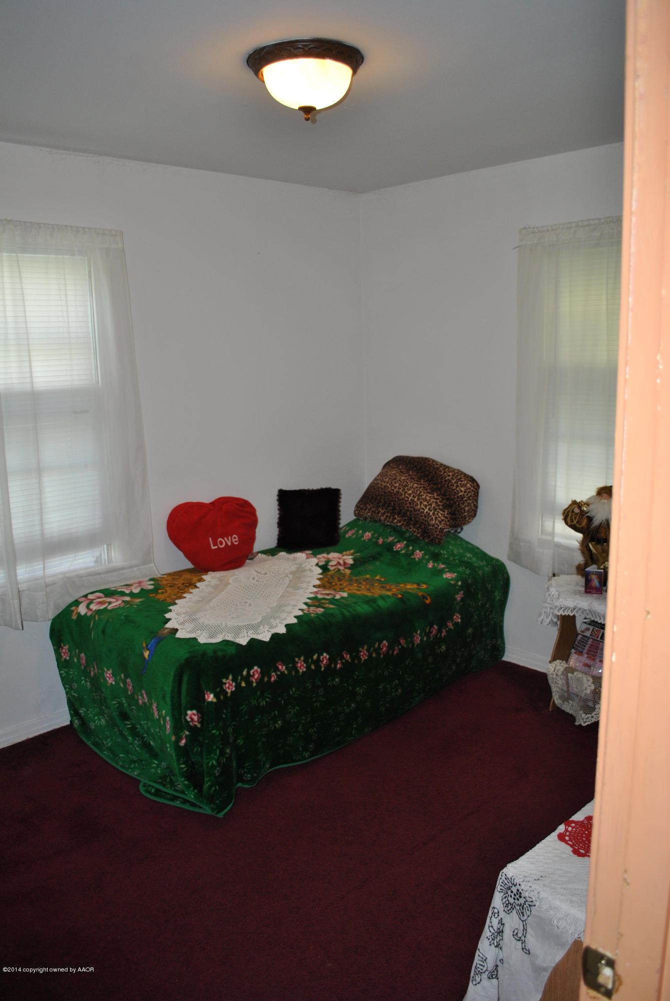4625 Cline Road Amarillo, TX 79110 - Photo 6 of 16 a bedroom with a bed dresser and a shower