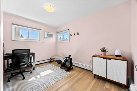 a view of a workspace with furniture and a workspace