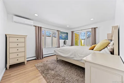 a bed room with a bed and a window