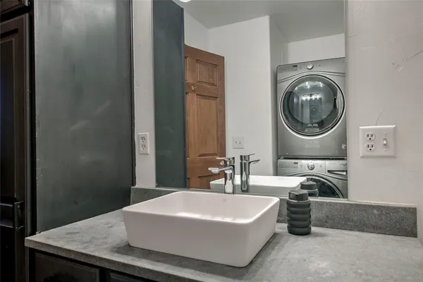 a bathroom with a bathtub and a sink