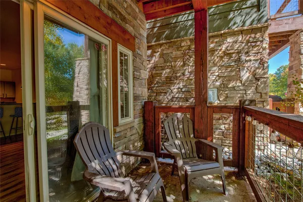 a view of balcony with furniture