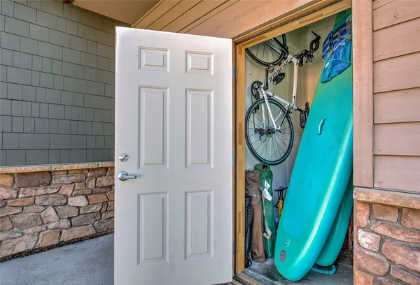 a view of a backyard with door and a potted plant